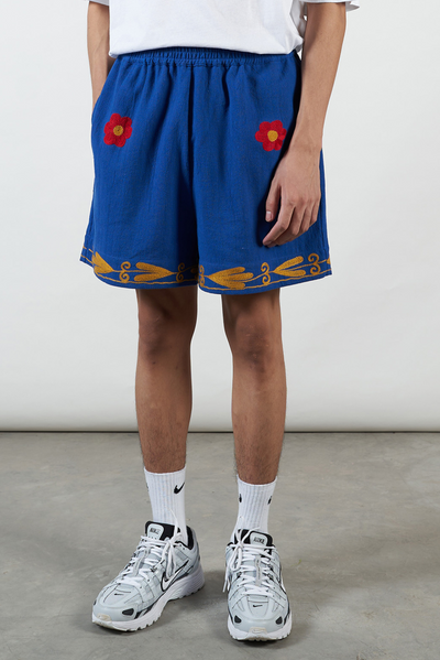 Blue Cotton Khadi shorts, Red and Gold hand embroidery, sustainable brand, unique piece, skilled craftsmanship.